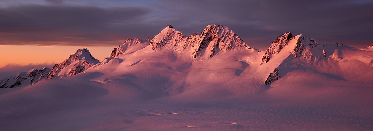 Rosy dusk light on mountain range