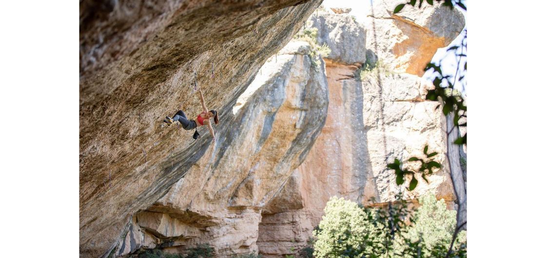 Female climber on steep route.