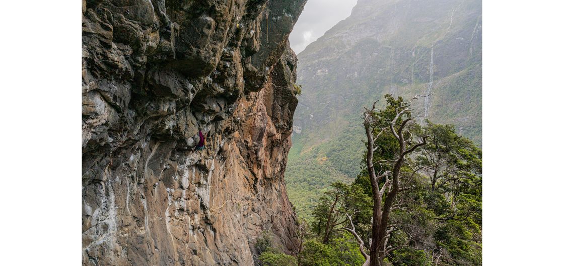 Becca Hounsell on Moses (27). Photo: Nat Warburton Climber on steep granite in fiords