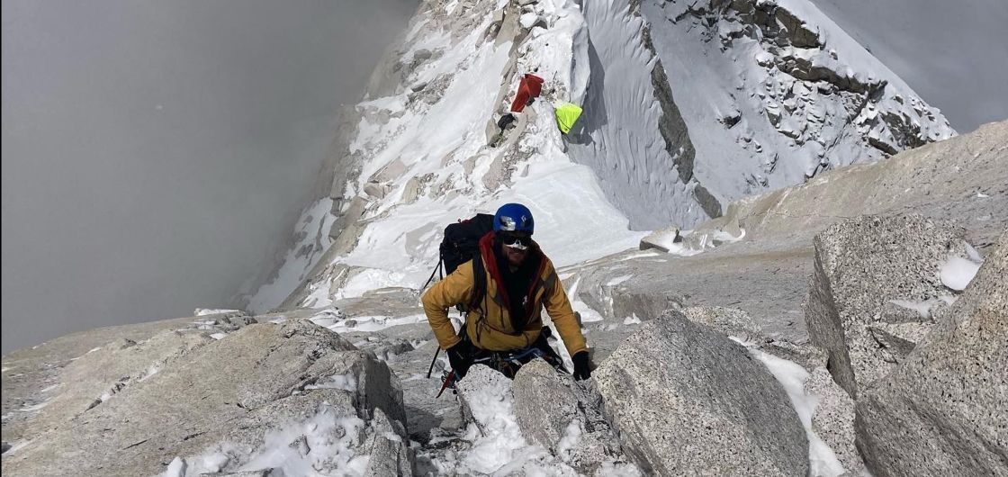 Alpine climber on exposed rockface