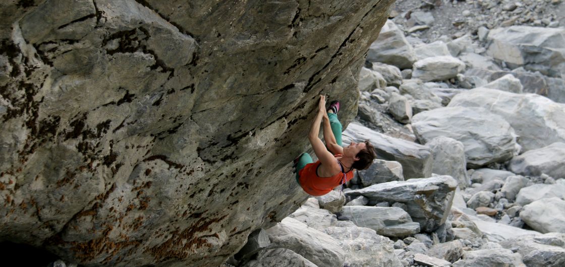 Female climber on steep rock.