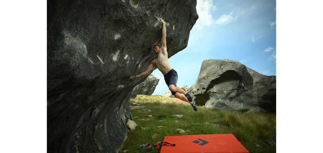 Boulderer jumping