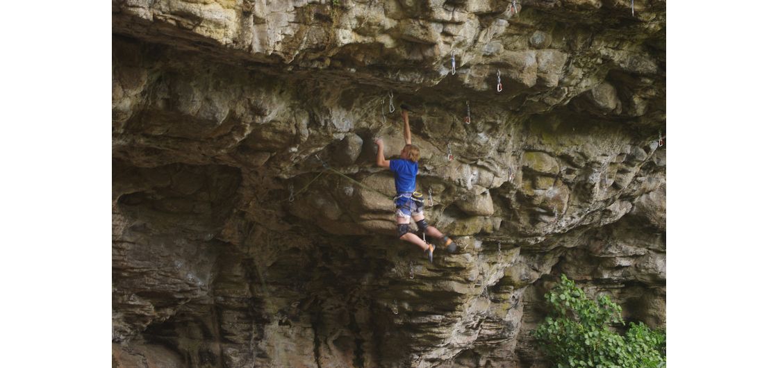 Climber on steep roof