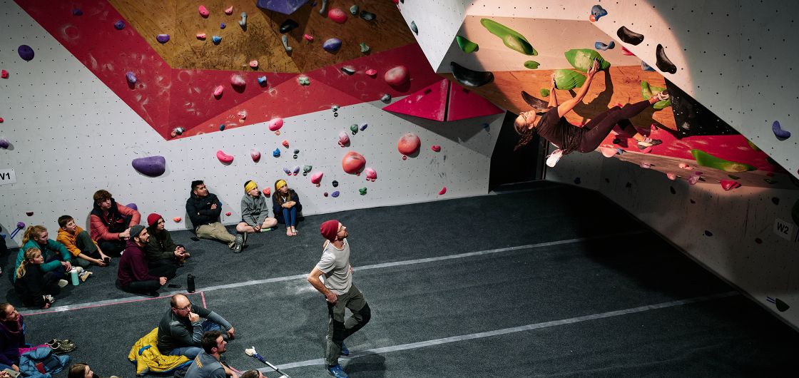 Cirrus Tan climbing to victory in the women's category. Photo: Tom Hoyle Female competitor on competition boulder problem