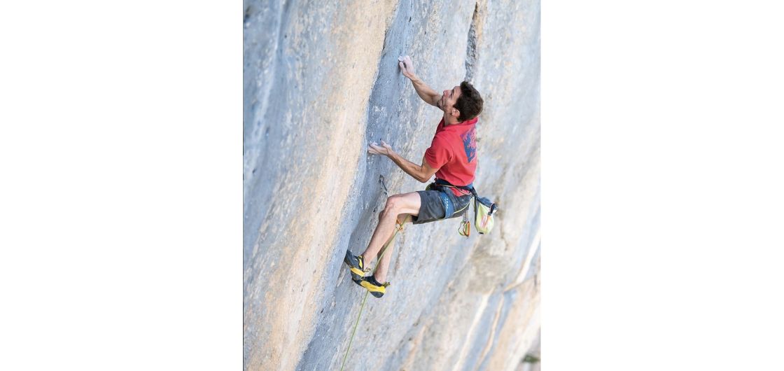 Stefano Ghisolfi on Bibiographie, Ceuse. Photo: Rainer Eder Climber on steep limestone route.