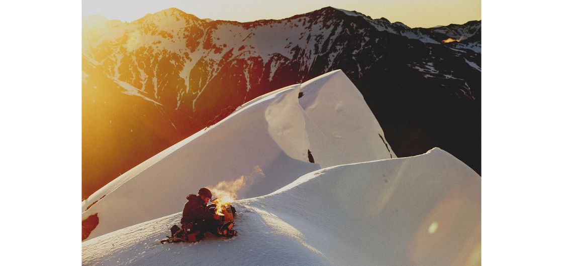 Morning brew. Photo: Hugh Baird. Camper on peak