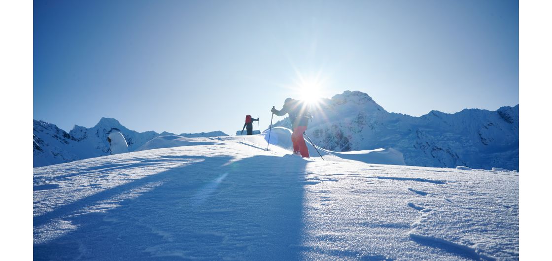 Skiers in alpine terrain