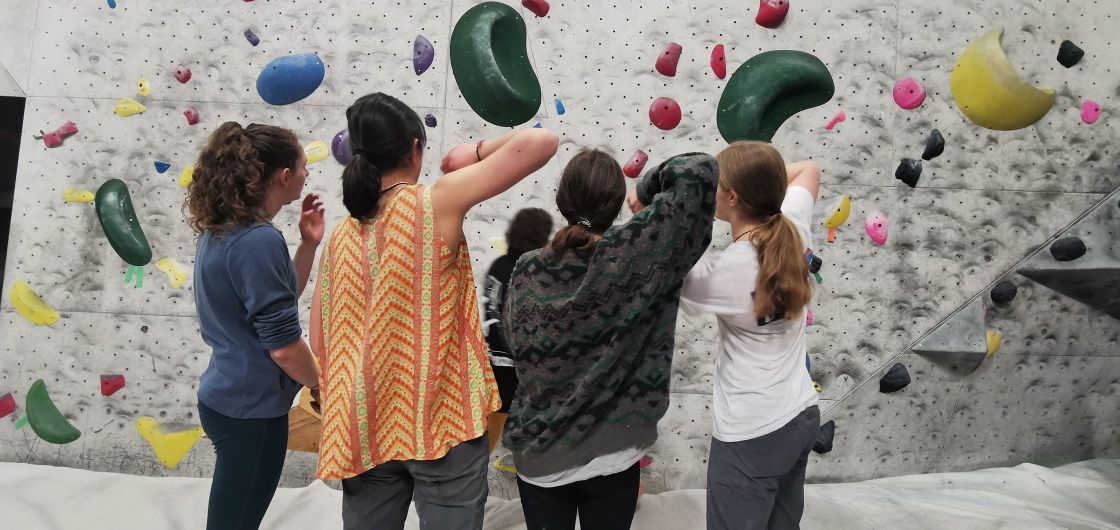 Competiton boulderers observe the problems before competing