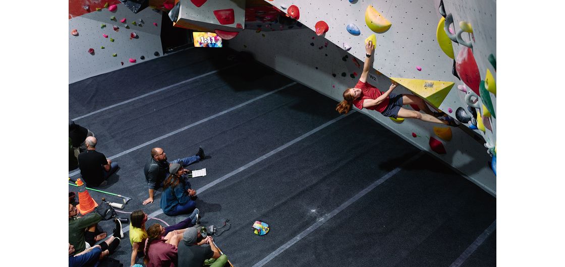 Becca Hounsell attempts W2 during the final. Photo: Tom Hoyle Competition climber on indoor boulder problem