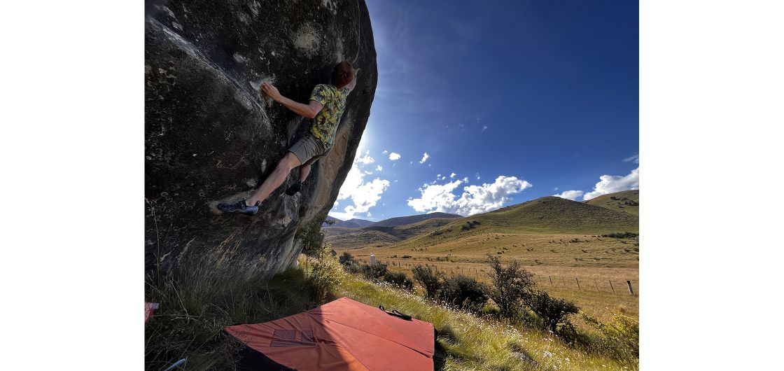 Oskar Wolff attempting Vendetta (V12), Quantum Field. Photo: Emma De Lange Boulderer on limestone boulder