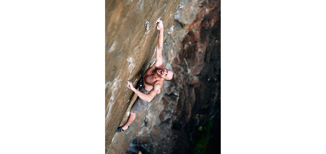 Isaac Buckley digging deep at the crux on an attempt of the undercling masterpiece Katalepsis (32), Babylon, Fiordland. Photo: Tom Hoyle