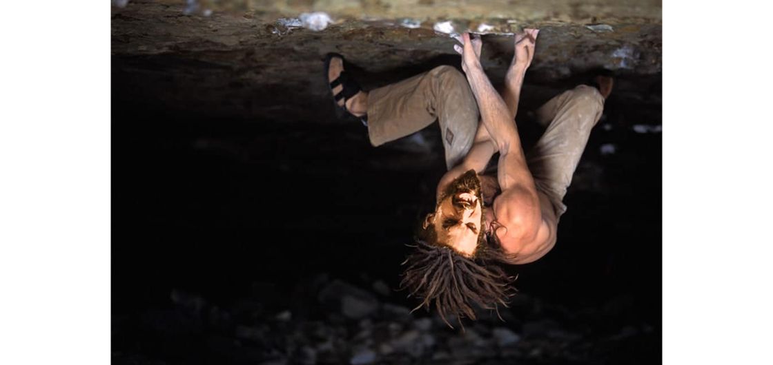 Climber expresses himself on steep rocks