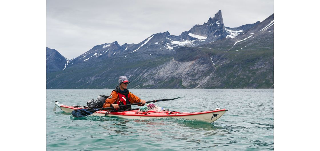 Stanley kayaking on Tasermiut Fjord, Greenland, 2014 Man in kayak