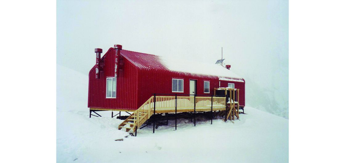 Hut in snowy white-out