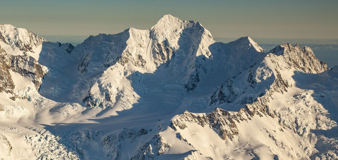 Horo Kouau / Mt Tasman, with Syme Ridge sunlit just right of centre. Photo: Colin Monteath/Hedgehog House A view of Mt Tasman