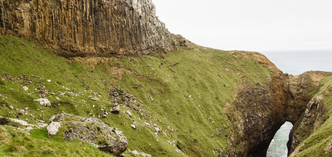Lovers Leap Steep rock face leads to zawn above the ocean