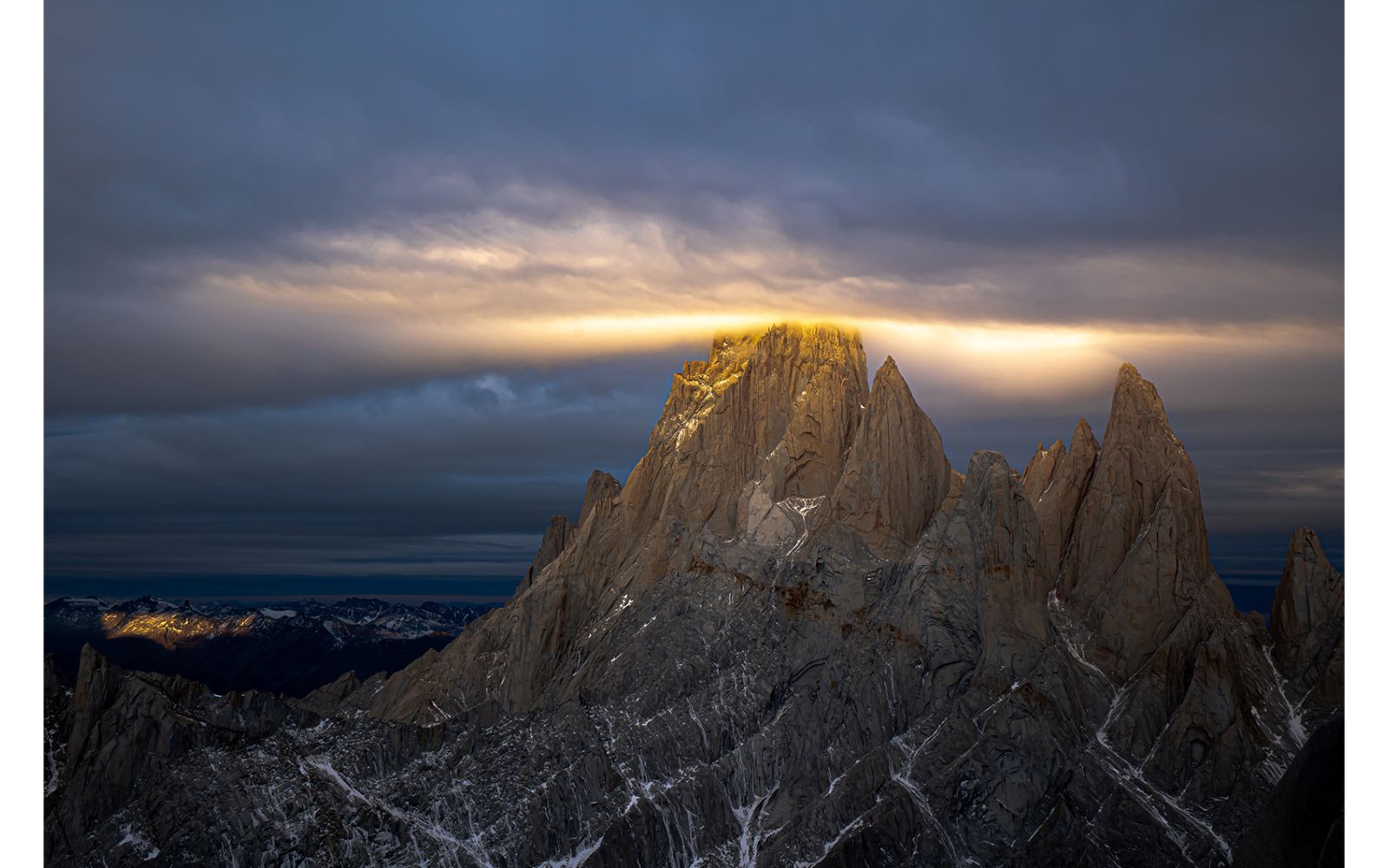 Clouds and sun around a mountain top