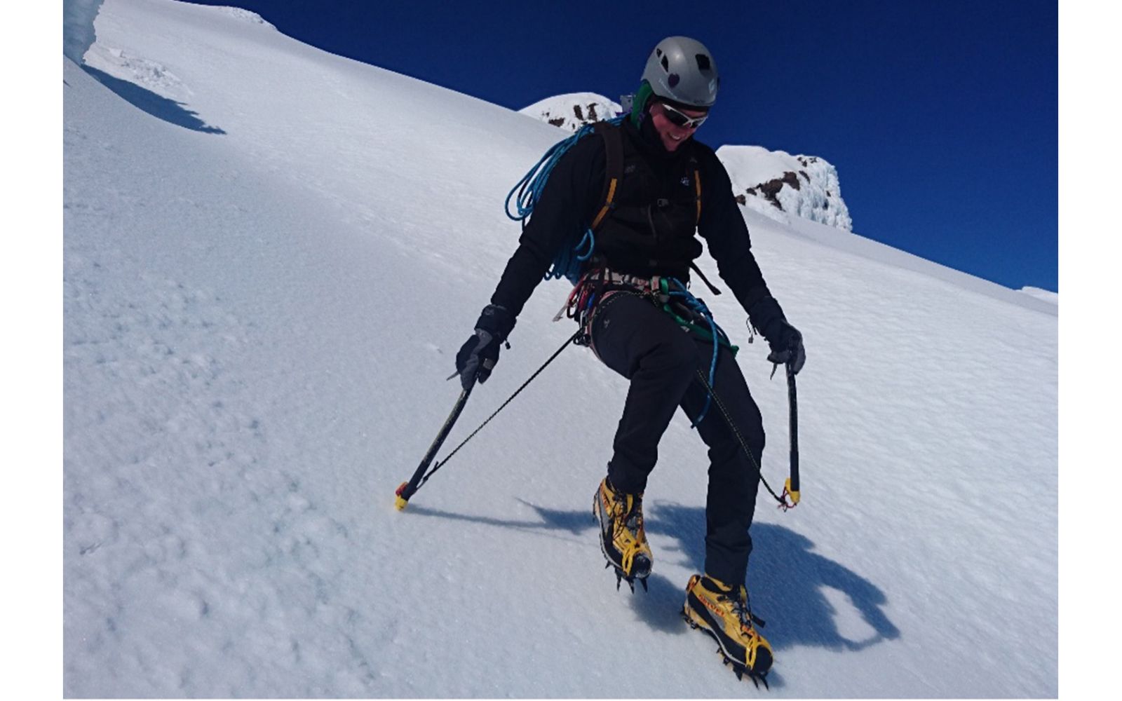 Mountaineer descending steep slope