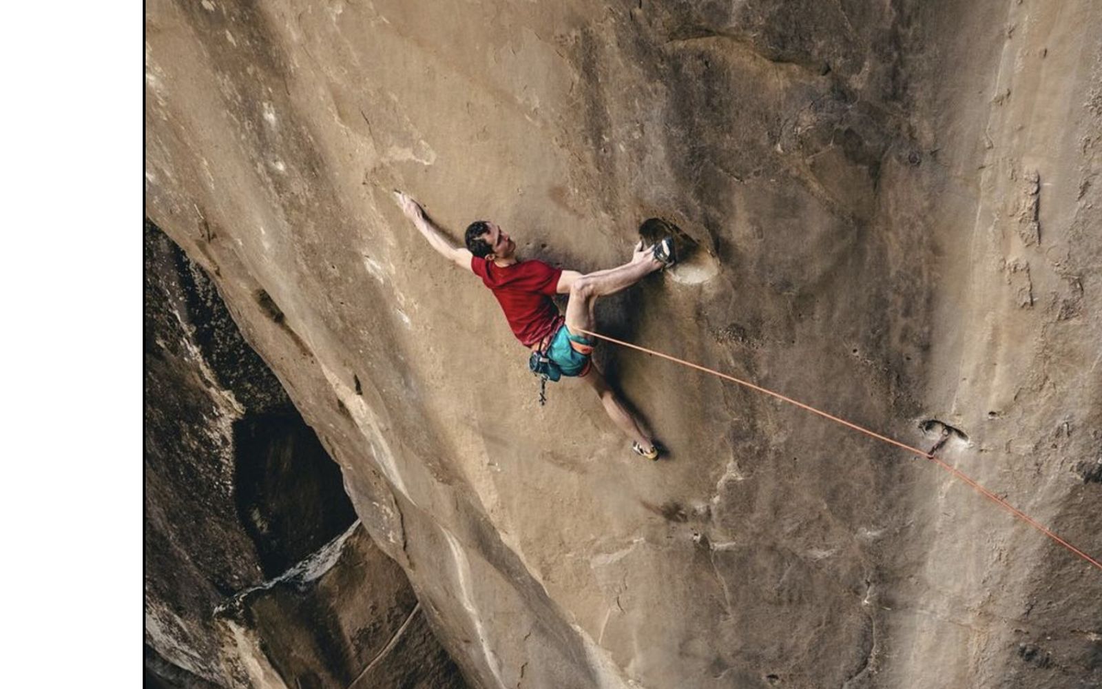 Climber on crazy hard trad route