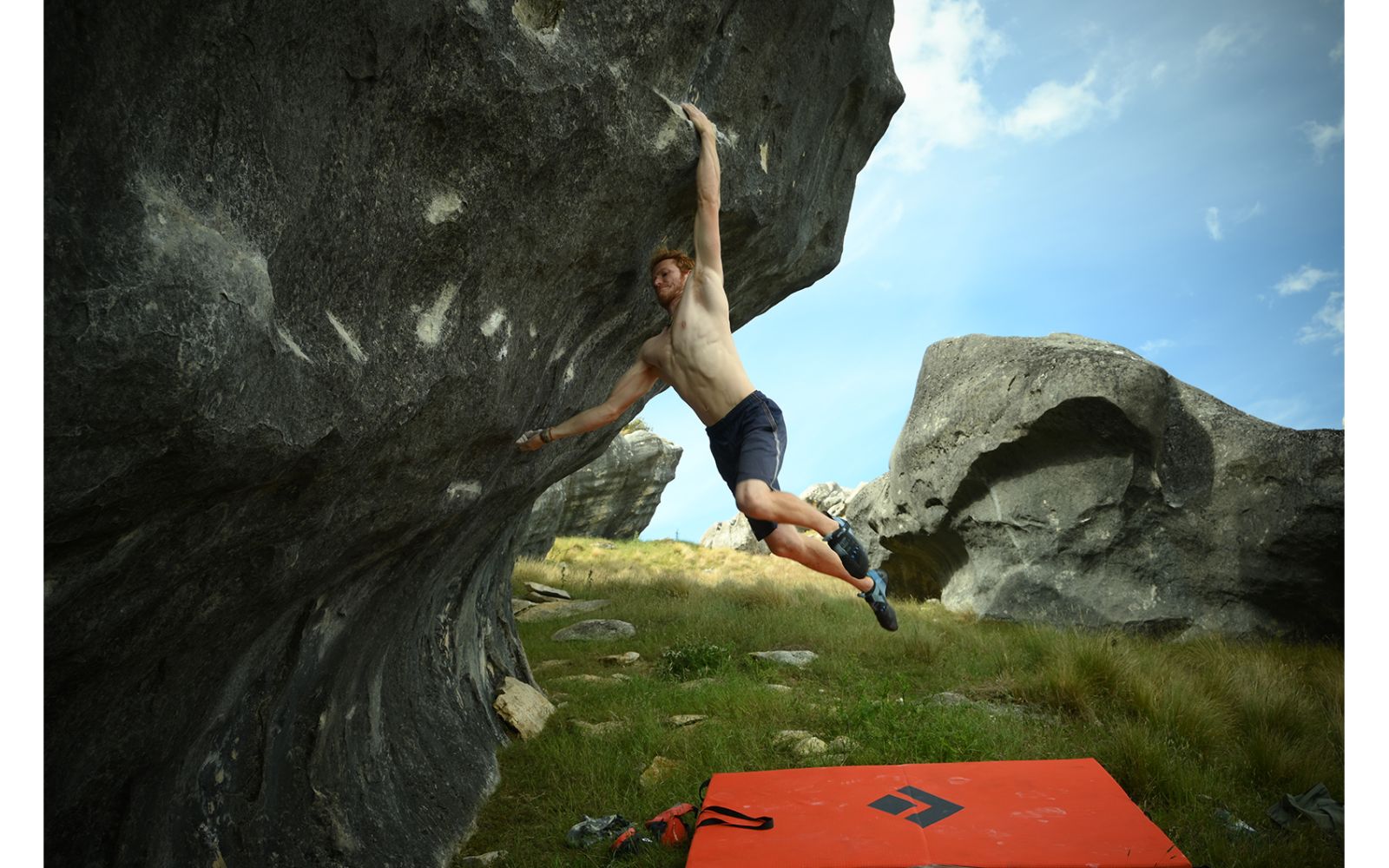 Boulderer jumping