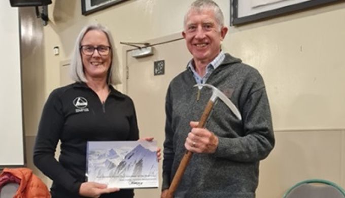 Derek Crombie receiving the VOTY axe from Clare Kearney