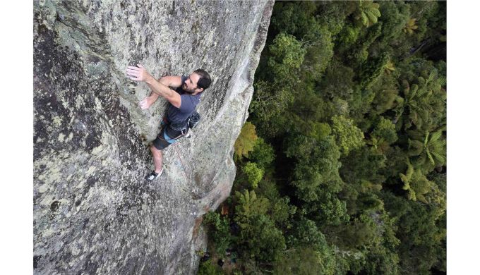 Climber on lichenous ignimbrite