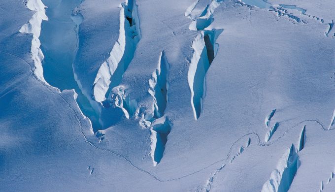 Walking tracks across a crevassed glacier