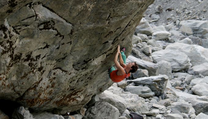 Female climber on steep rock.