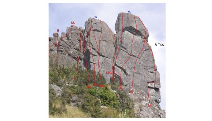 Rock outcrop with climbing routes marked