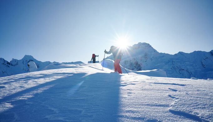 Skiers in alpine terrain