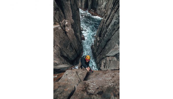Rock climber above sea