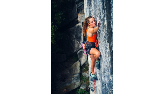 Fia Warburton focused on the gentlemen's club "White Pepper". Photo: Nat Warburton climber on rock face