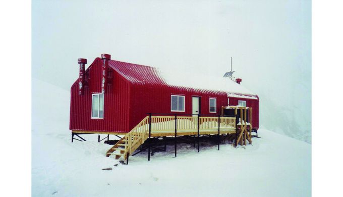 Hut in snowy white-out