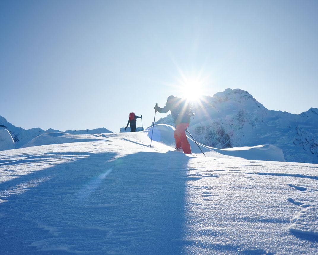 Skiers in alpine terrain