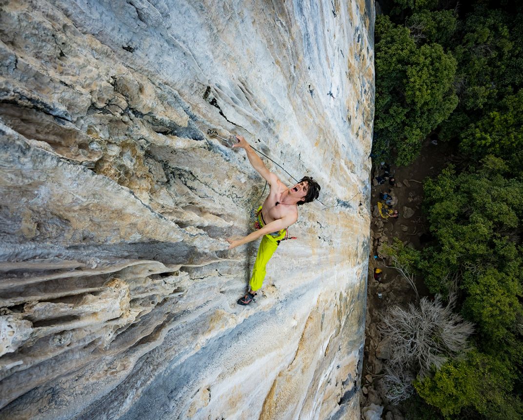 Rock climber clips carabiner