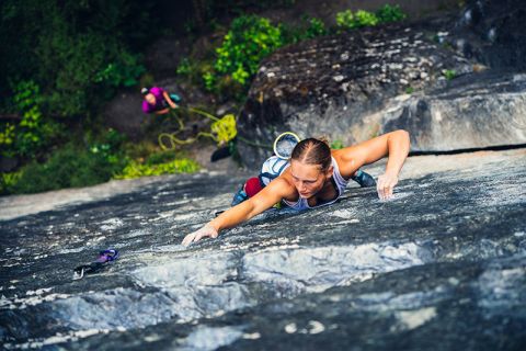 Climber on sheer rock face