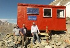 Murchison Hut exterior with people