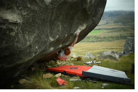 Boulderer on sit start limestone boulder problem