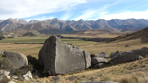 Climber on large boulder