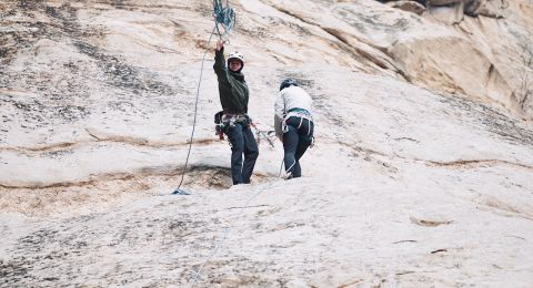 rock climber prepares abseil