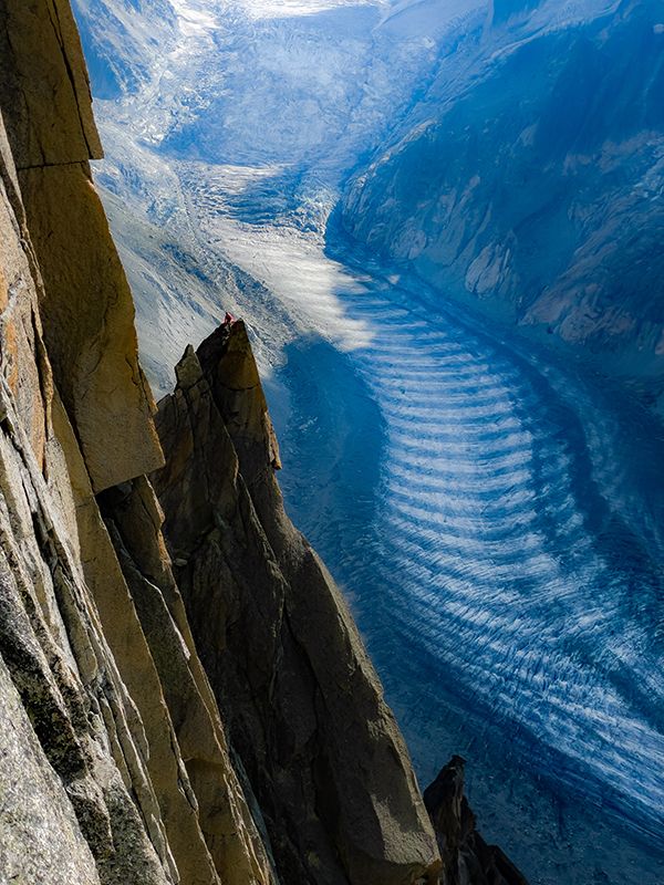 Climber above glacier