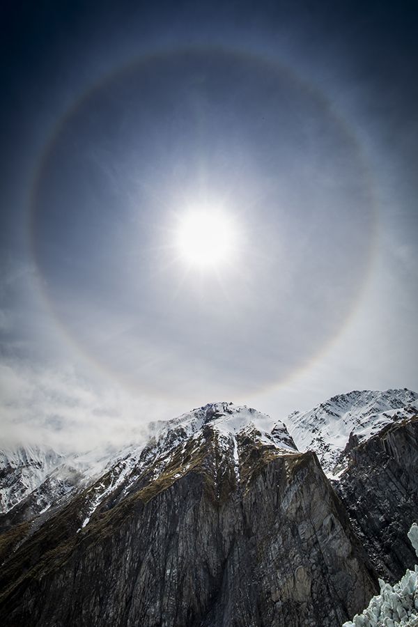 Sun halo over mountain