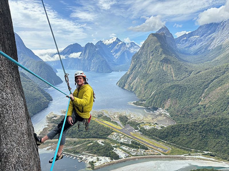 Climber abseiling big wall route