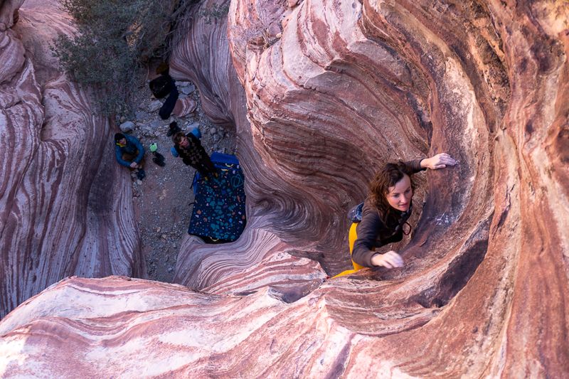 Female climber climbing water groove