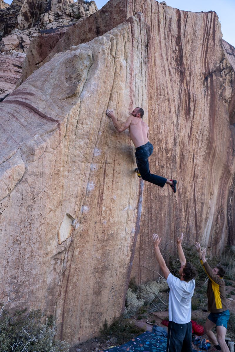 Climber squeezing fridge