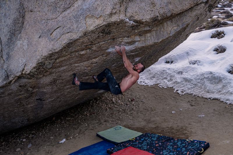 Boulderer trying hard