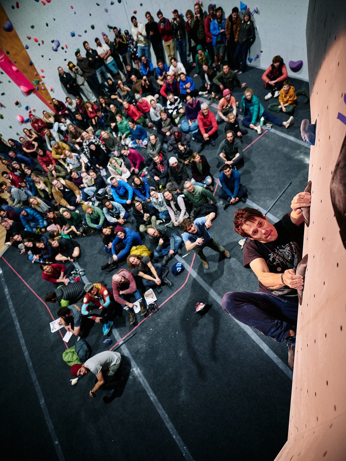 Male competitor on competition boulder problem