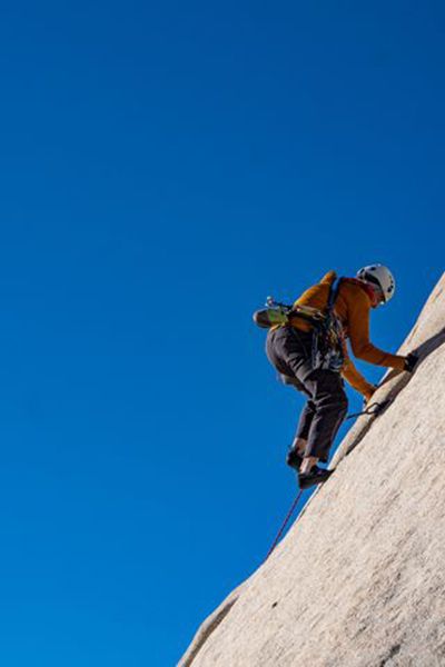 Climber on granite slab