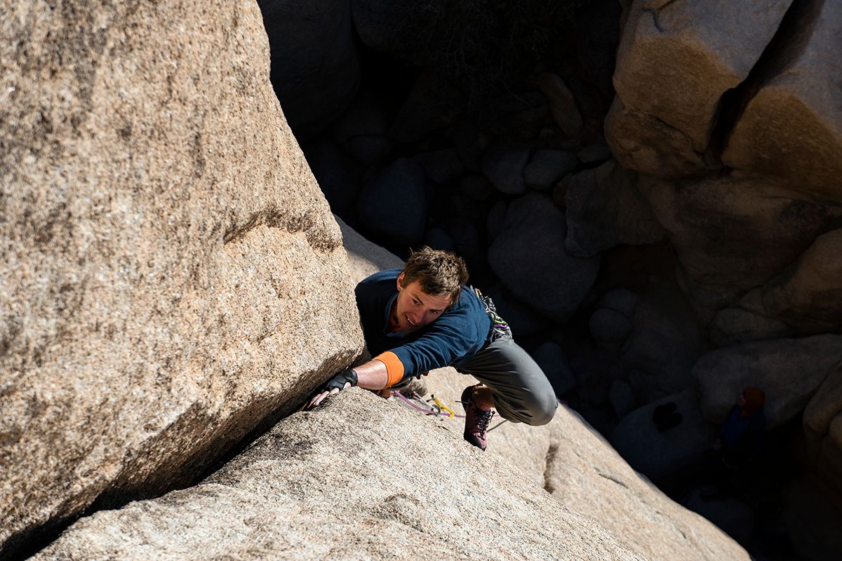 Climber on desert granite crack