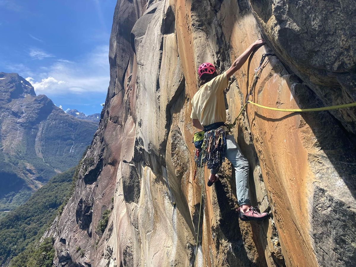 Climber on orange granite